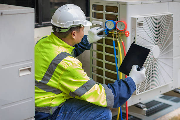 Professional Air Duct Cleaning technician working in Easton, MA